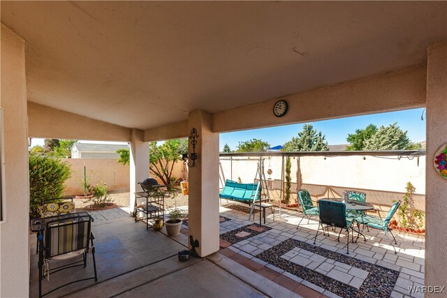 view of patio / terrace featuring outdoor dining area and a fenced backyard