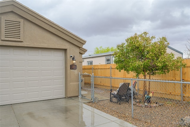 garage with fence