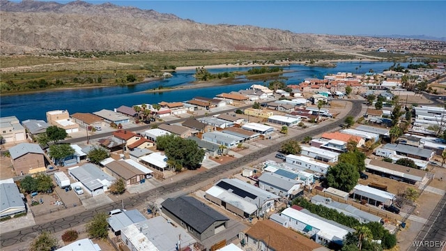 drone / aerial view featuring a residential view and a water view