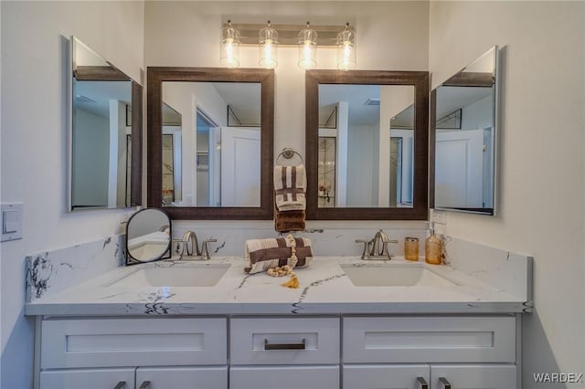 full bath with double vanity and a sink