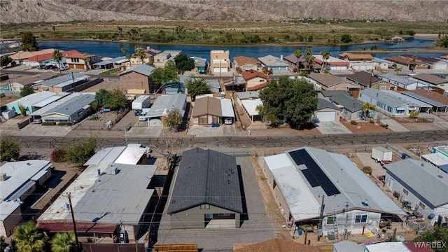 bird's eye view with a residential view and a water view