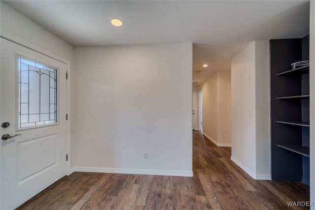 foyer with recessed lighting, wood finished floors, and baseboards