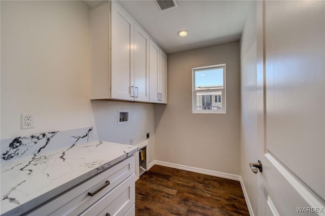 clothes washing area with visible vents, dark wood finished floors, hookup for a washing machine, cabinet space, and electric dryer hookup