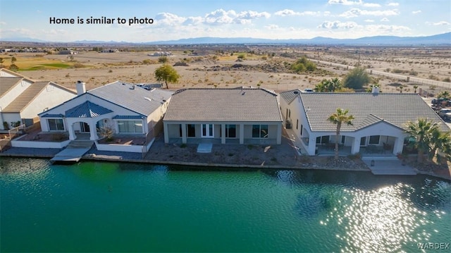 bird's eye view featuring a water and mountain view