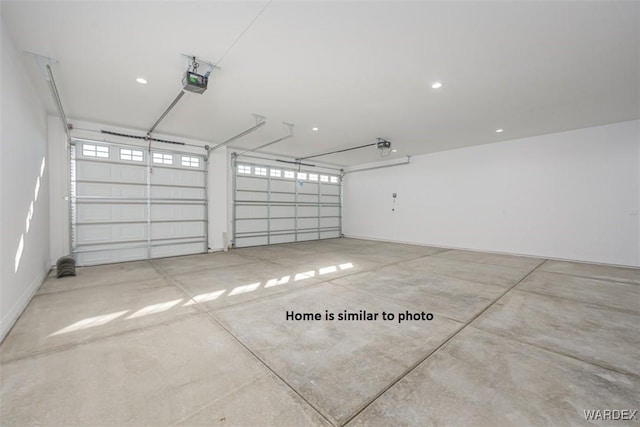 garage featuring a garage door opener and recessed lighting