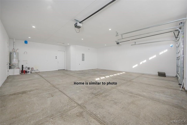 garage featuring gas water heater, electric panel, and a garage door opener