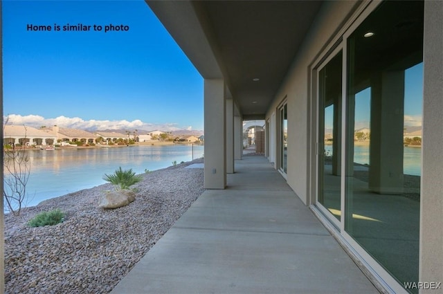 view of patio featuring a water view