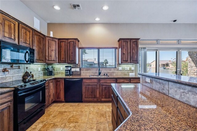 10726 S Shimmering Way, Mohave Valley, AZ 86440 - kitchen featuring black appliances, backsplash, dark stone countertops, and recessed lighting