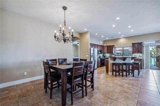10726 S Shimmering Way, Mohave Valley, AZ 86440 - dining area featuring a chandelier, recessed lighting, and light tile patterned floors