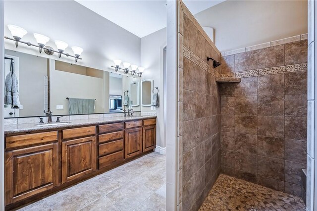 10726 S Shimmering Way, Mohave Valley, AZ 86440 - bathroom with a tile shower, double vanity, and tile patterned floors