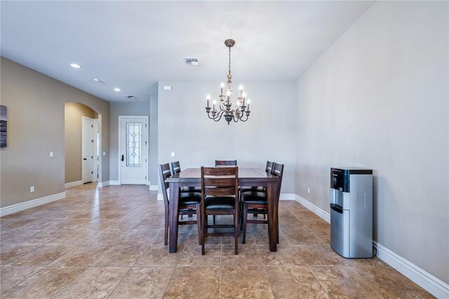 10726 S Shimmering Way, Mohave Valley, AZ 86440 - dining room featuring arched walkways, a chandelier, and recessed lighting