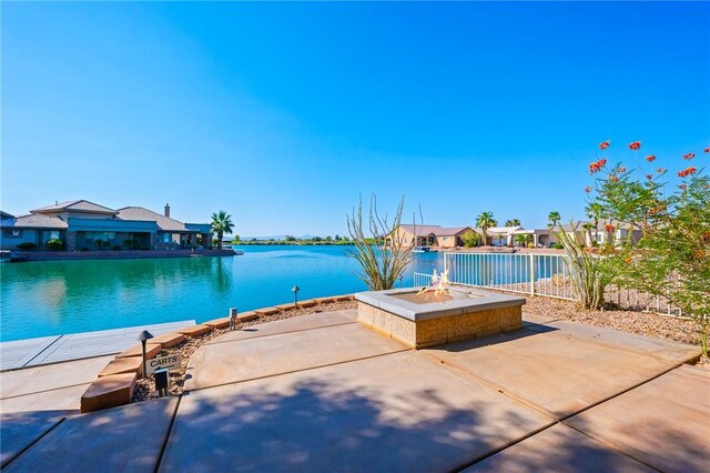 10726 S Shimmering Way, Mohave Valley, AZ 86440 - view of pool with a fire pit, a patio, a water view, and a swimming pool