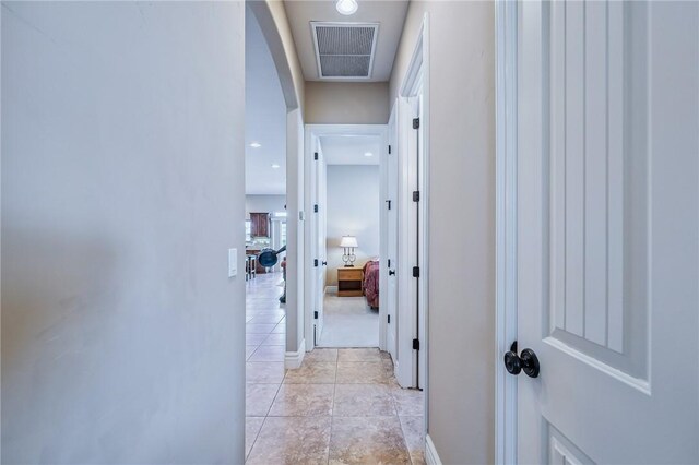 10726 S Shimmering Way, Mohave Valley, AZ 86440 - corridor with light tile patterned floors and arched walkways