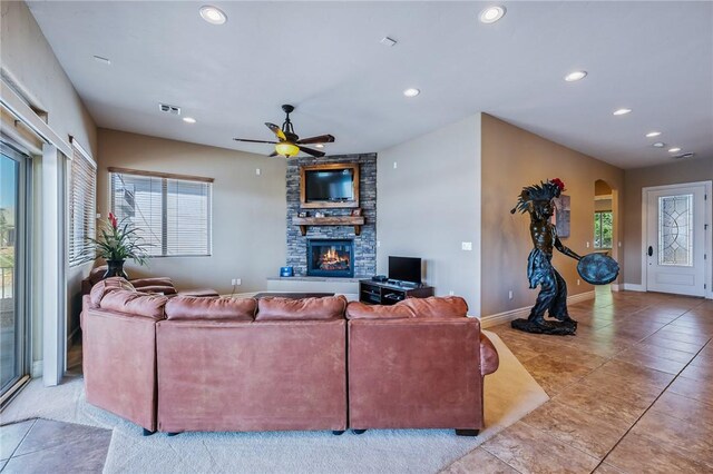 10726 S Shimmering Way, Mohave Valley, AZ 86440 - living area featuring a fireplace, recessed lighting, arched walkways, ceiling fan, and light tile patterned floors