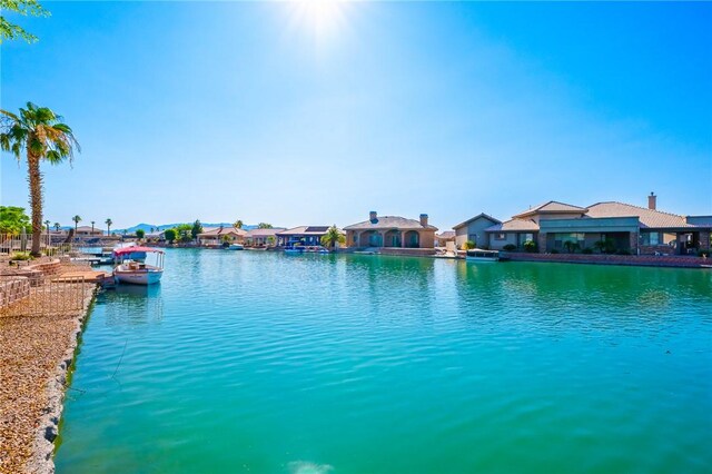 10726 S Shimmering Way, Mohave Valley, AZ 86440 - water view with nearby suburban area and a boat dock