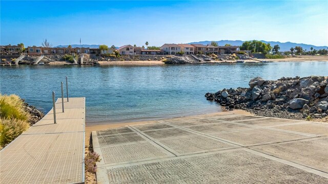 10726 S Shimmering Way, Mohave Valley, AZ 86440 - dock featuring a boat ramp, a residential view, and a water view