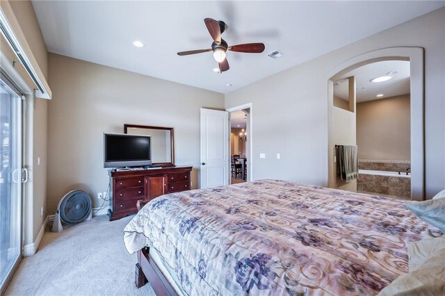 10726 S Shimmering Way, Mohave Valley, AZ 86440 - bedroom featuring carpet floors, arched walkways, recessed lighting, a ceiling fan, and ensuite bath