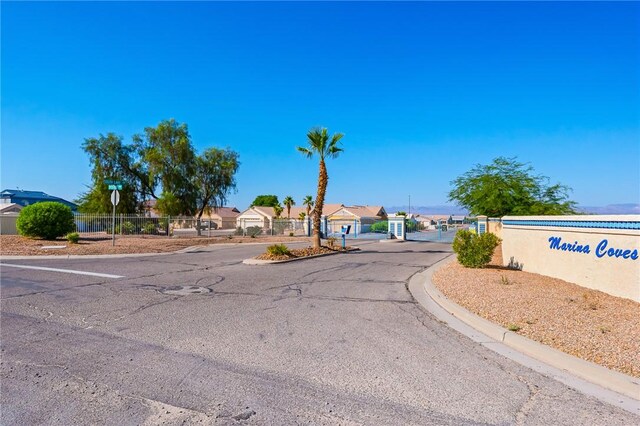 10726 S Shimmering Way, Mohave Valley, AZ 86440 - view of asphalt street with curbs and traffic signs