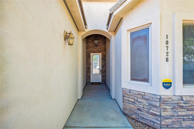 10726 S Shimmering Way, Mohave Valley, AZ 86440 - view of exterior entry featuring stucco siding and stone siding