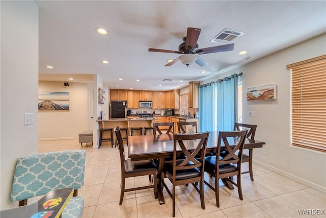 dining area with light tile patterned floors, recessed lighting, visible vents, ceiling fan, and baseboards