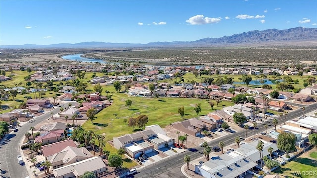 drone / aerial view featuring a residential view and a water and mountain view