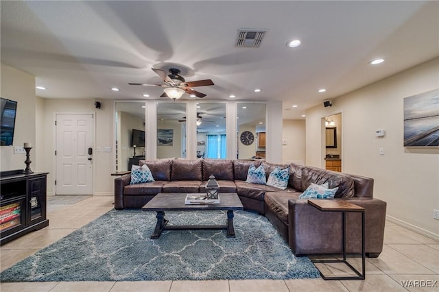 living room featuring recessed lighting, visible vents, baseboards, and light tile patterned floors