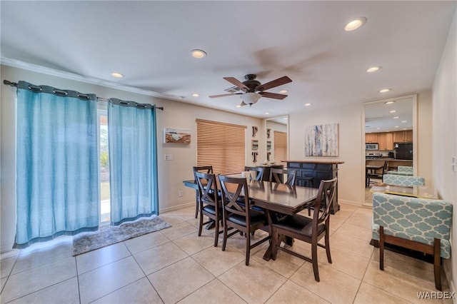 dining space featuring light tile patterned floors, baseboards, and recessed lighting