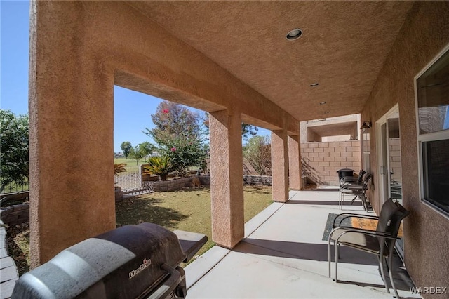 view of patio / terrace featuring fence