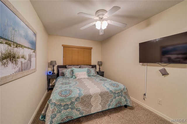 bedroom with a ceiling fan, carpet, and baseboards