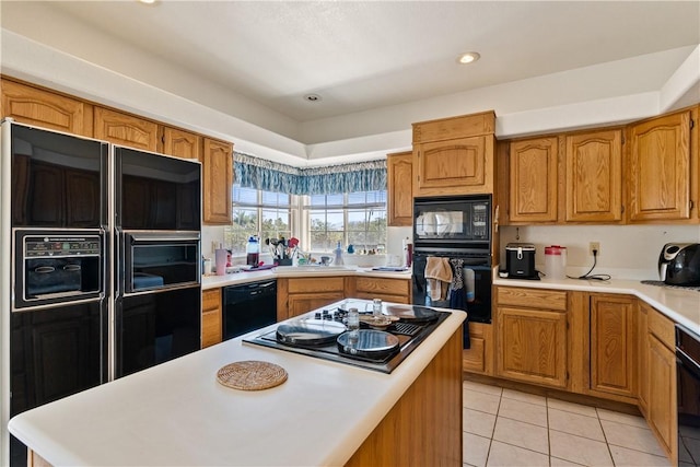 3628 N Venus Ct, Golden Valley, AZ 86413 - kitchen featuring black appliances, light countertops, light tile patterned floors, brown cabinets, and recessed lighting