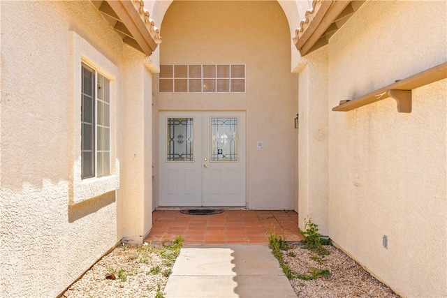 3628 N Venus Ct, Golden Valley, AZ 86413 - view of exterior entry featuring stucco siding and french doors