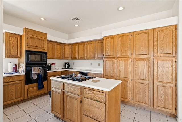 3628 N Venus Ct, Golden Valley, AZ 86413 - kitchen with black appliances, light tile patterned floors, light countertops, a kitchen island, and recessed lighting