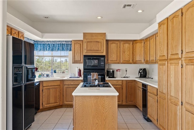 3628 N Venus Ct, Golden Valley, AZ 86413 - kitchen featuring black appliances, light tile patterned floors, a kitchen island, light countertops, and recessed lighting