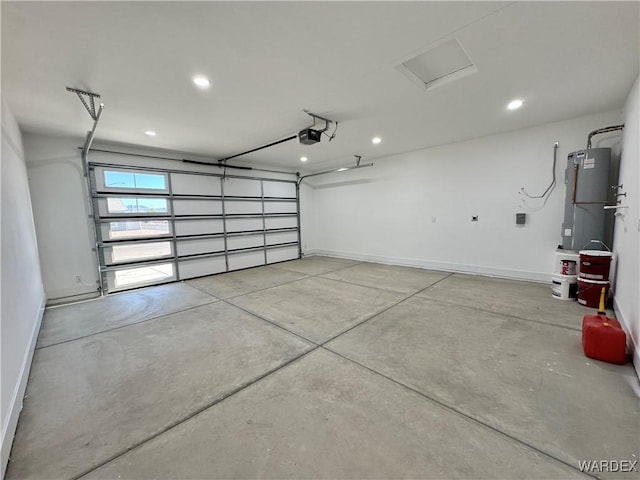 garage featuring recessed lighting, baseboards, and a garage door opener