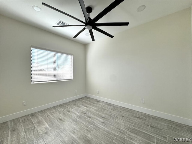 unfurnished room with ceiling fan, light wood finished floors, recessed lighting, and baseboards