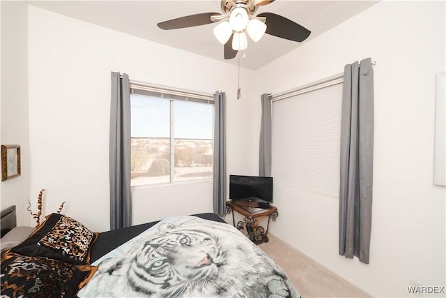 carpeted bedroom featuring a ceiling fan