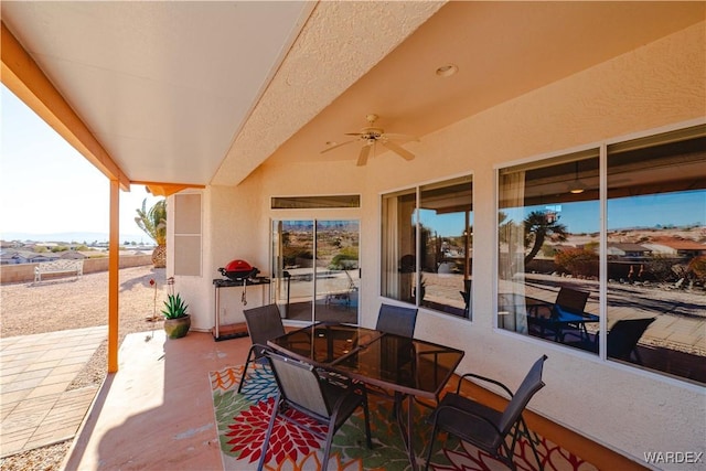 view of patio / terrace with outdoor dining space and ceiling fan