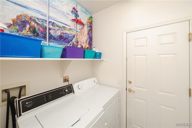 washroom featuring laundry area and washing machine and dryer