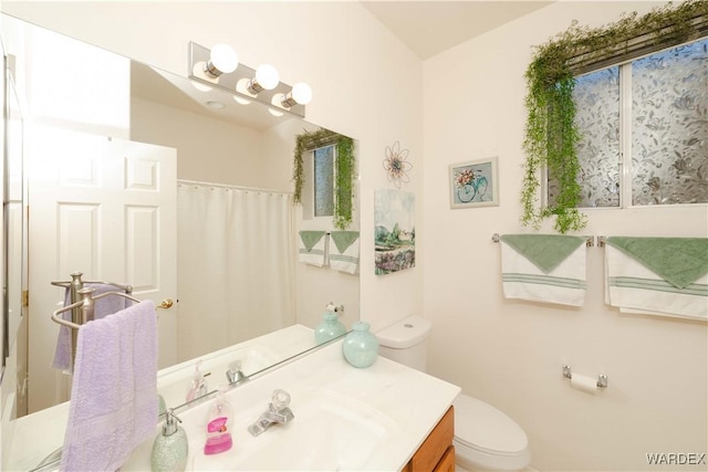 bathroom with vanity and toilet