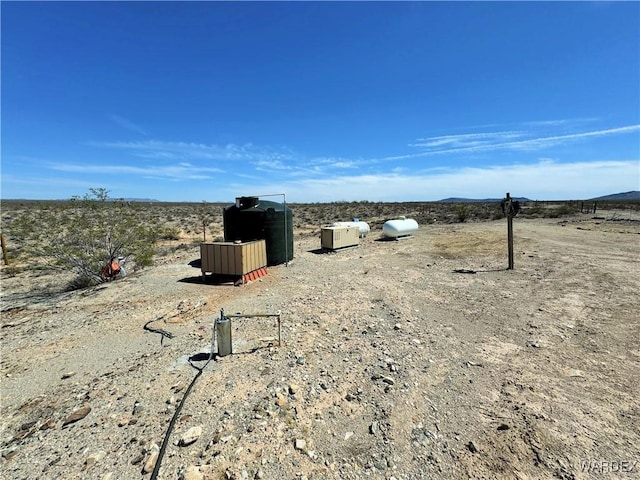 view of yard with a rural view