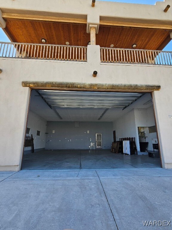 garage featuring concrete driveway