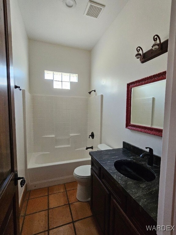 full bath with tile patterned flooring, toilet, vanity, visible vents, and tub / shower combination