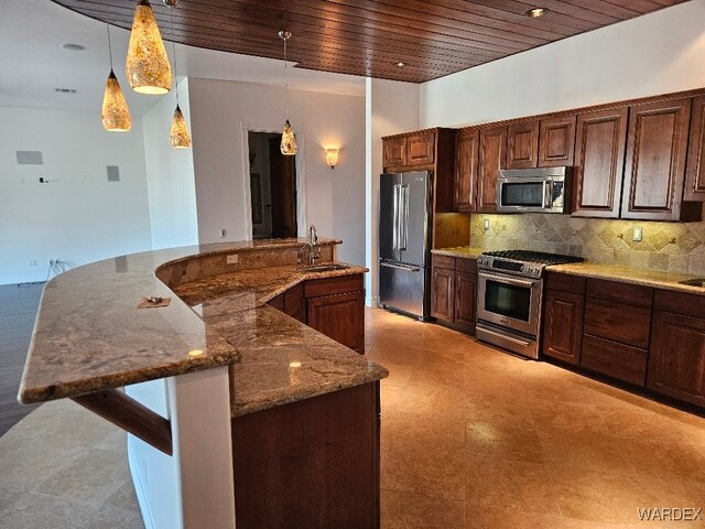 kitchen with decorative light fixtures, decorative backsplash, appliances with stainless steel finishes, a sink, and wooden ceiling