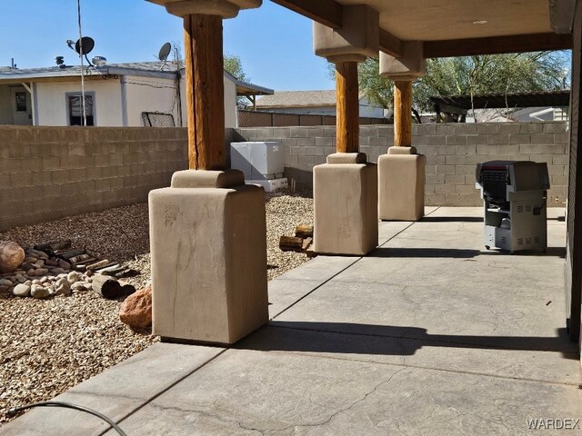 view of patio featuring fence