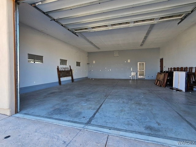 garage featuring baseboards