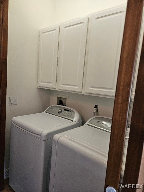 laundry area featuring cabinet space and washer and clothes dryer