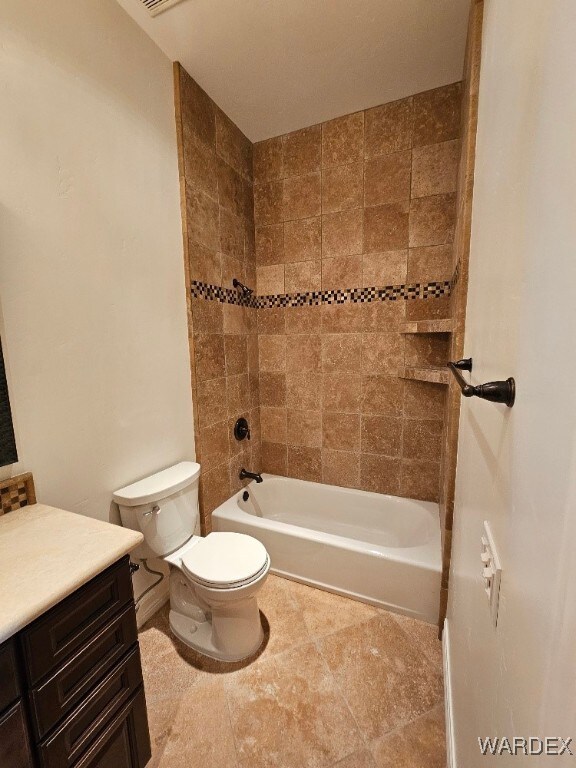 bathroom with toilet, washtub / shower combination, and vanity