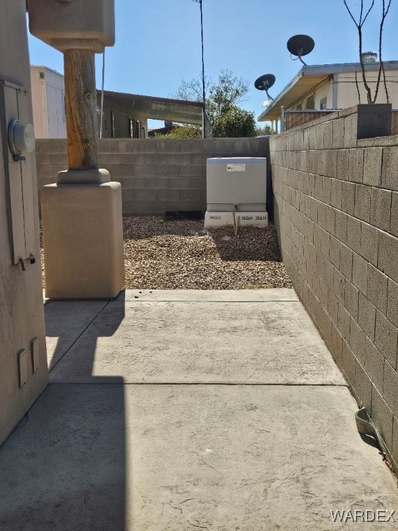 view of patio featuring fence