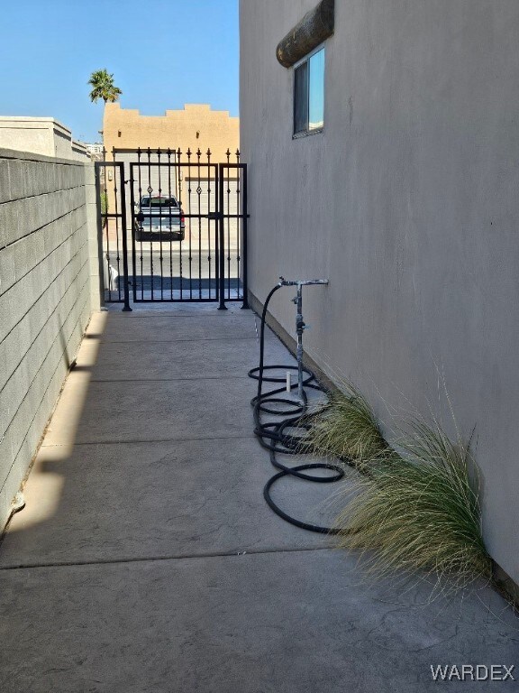 exterior space with a gate and fence