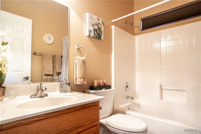 full bath with toilet, shower / bath combination, and vanity